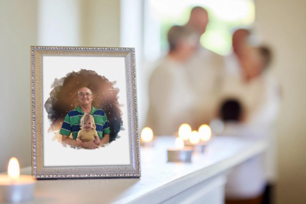 Portrait of loved one amongst candles with family in the background